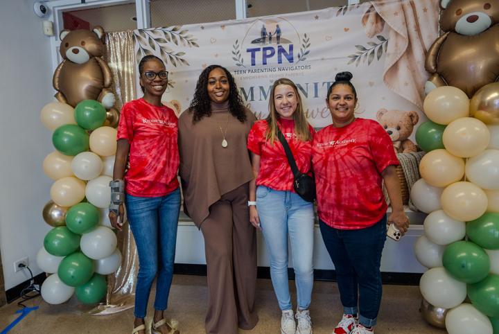 Guests at the TPN balloon backdrop